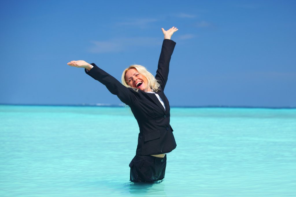 Businesswoman in the ocean happy launching business with pre-built hosted solutions